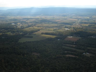 The view out front: LZ, valley, and the upwind ridge.